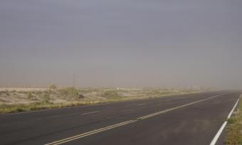 Empty road covered by haze