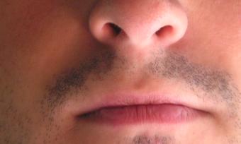 Close up photo of a man's nose and mouth