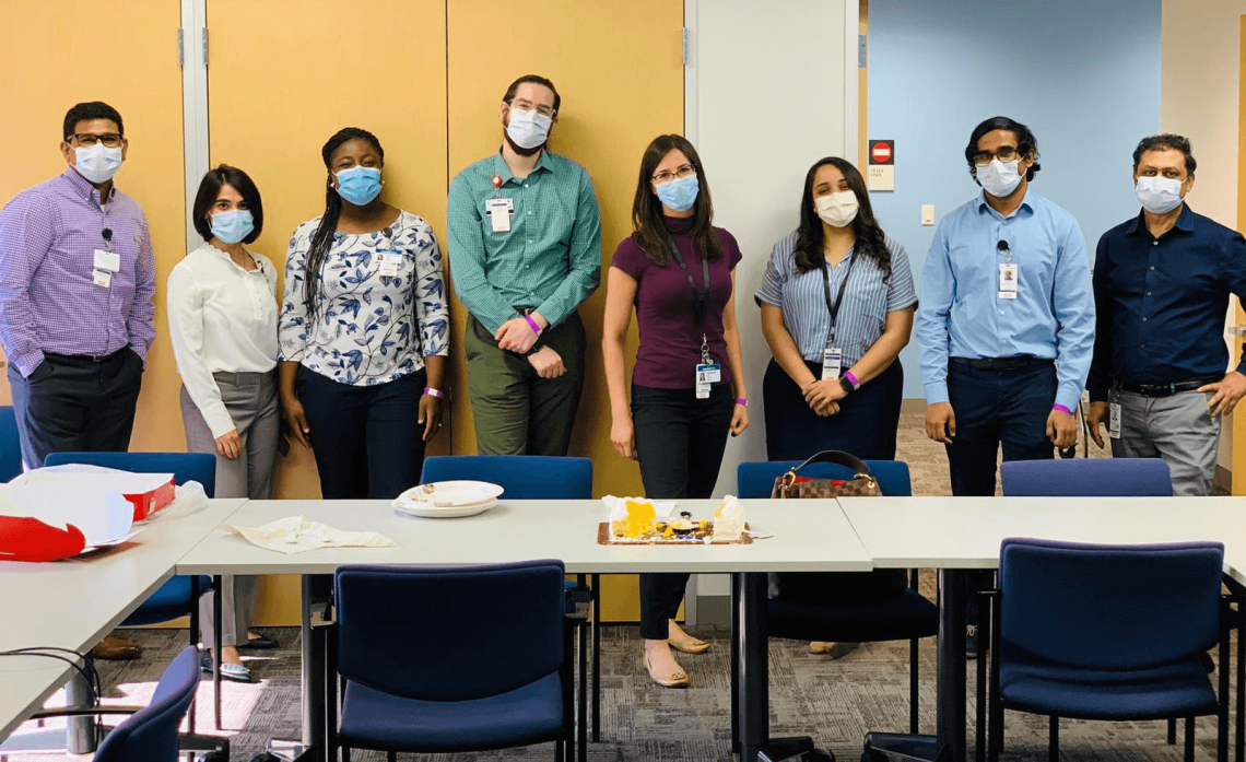 A group of new Child and Adolescent Psychiatry fellows pose in a lineup during their orientation