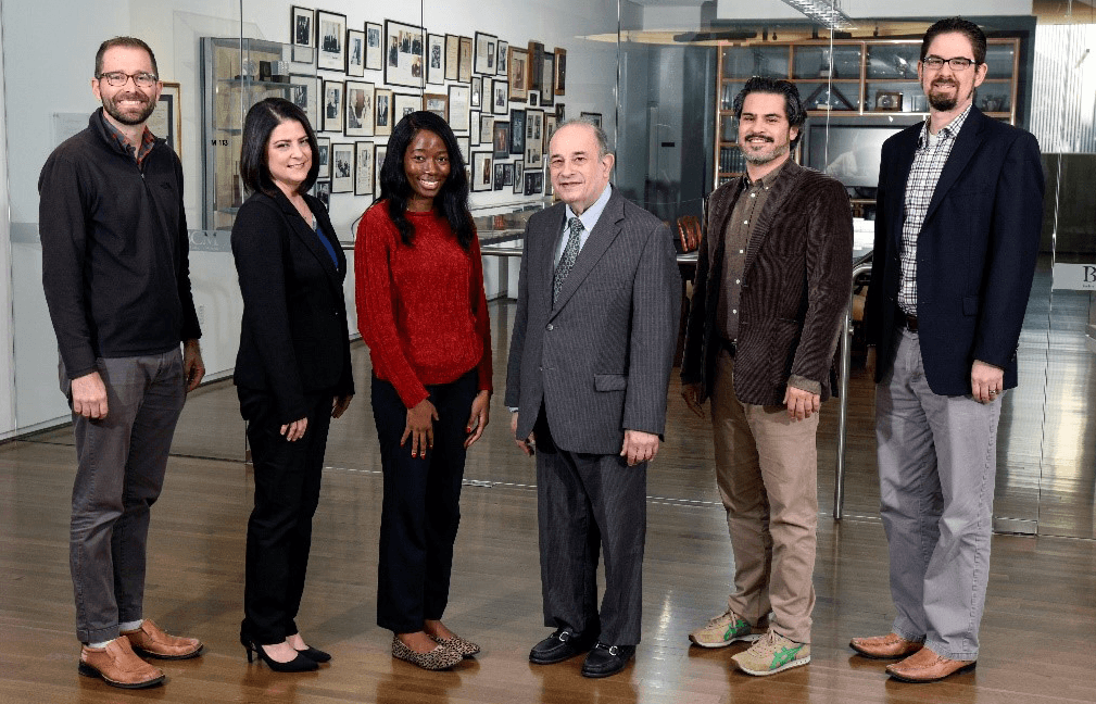 The Humanities Expressions and Arts Lab team stand in DeBakey Library