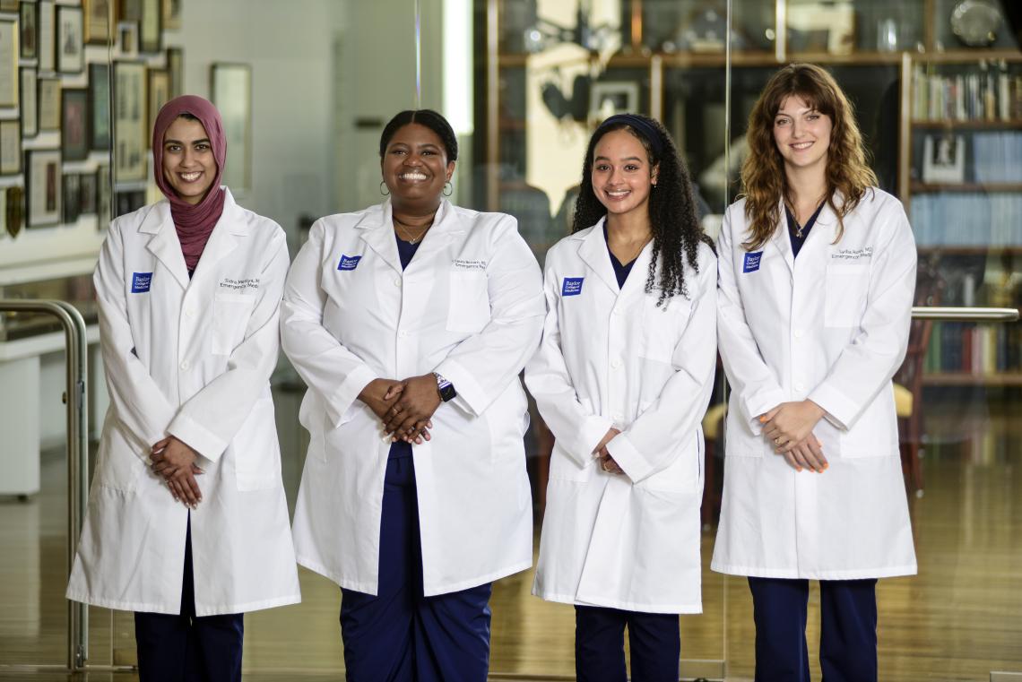 four chief residents at baylor college of medicine smiling