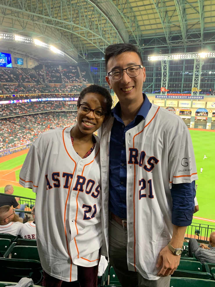 PACT Fellows Nurah Lawal and Selby Chu cheering on the Houston Astros