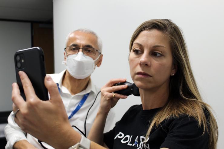 Polaris Dawn Spaceflight Participant Anna Menon uses portable ultrasound