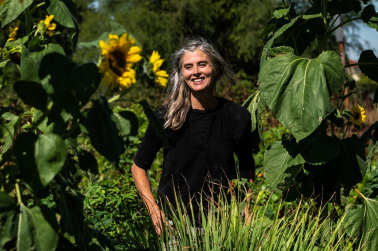 woman smiling in sunflower field