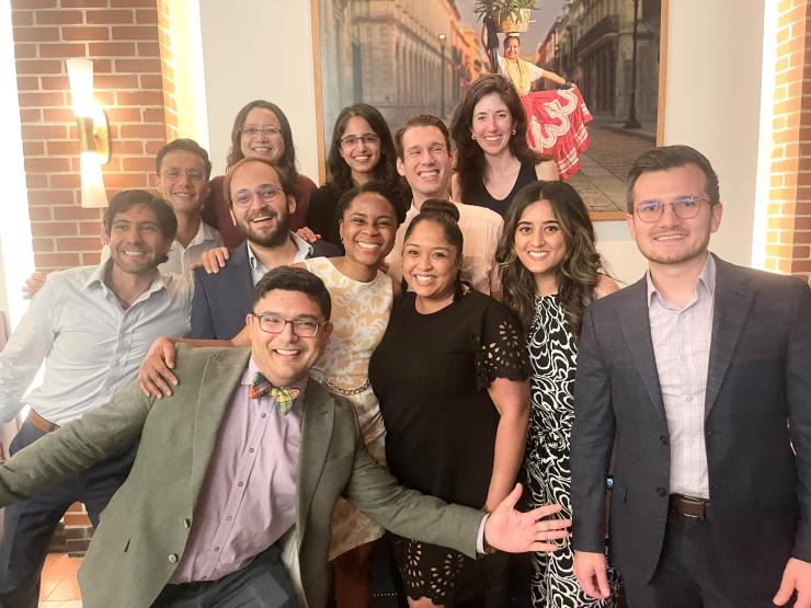 group of nicely dressed people smiling