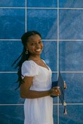 woman smiling posing with graduation cap