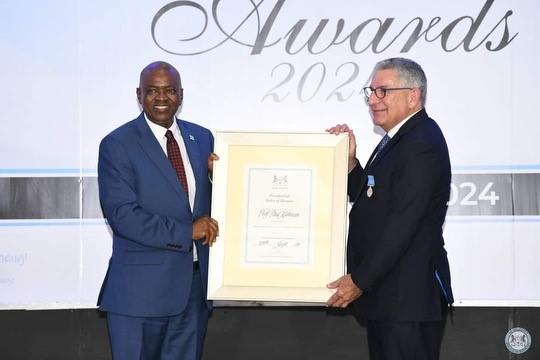  President Masisi of Botswana awarding Dr. Paul Klotman the Presidential Award.