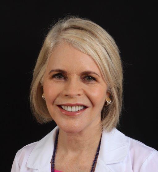 woman with short blonde hair smiling