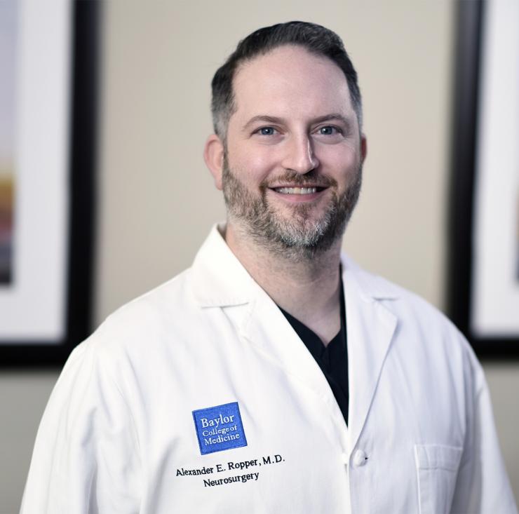 man in doctor's coat smiling