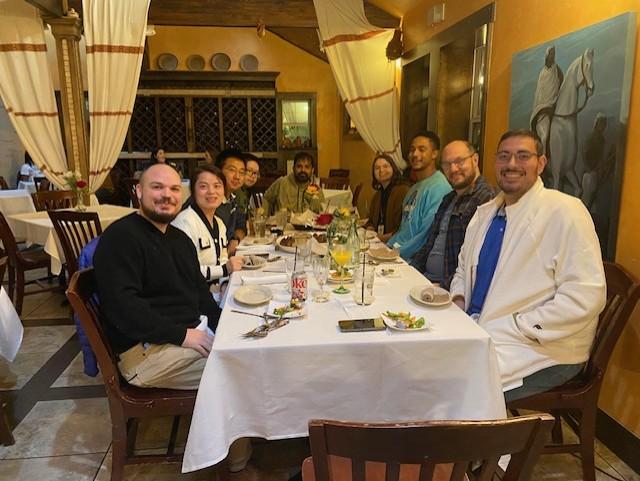 people sitting at a table in a restaurant