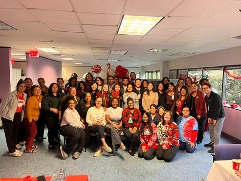 group of people posing at a holiday party