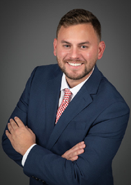 man in a blue suit smiling