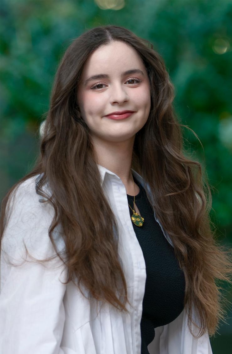 woman with long brown hair smiling