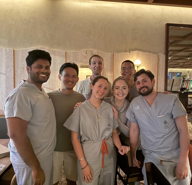 small group of doctors in scrubs smiling