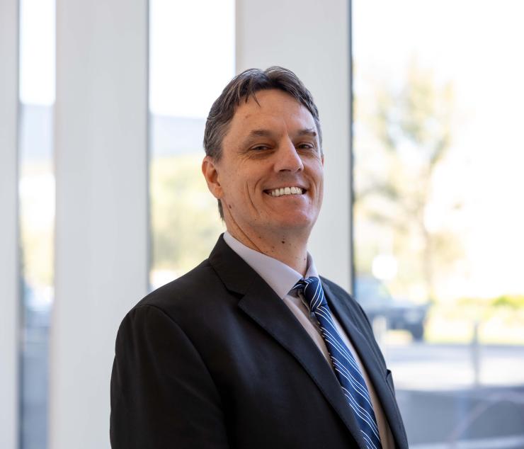 man in a suit smiling