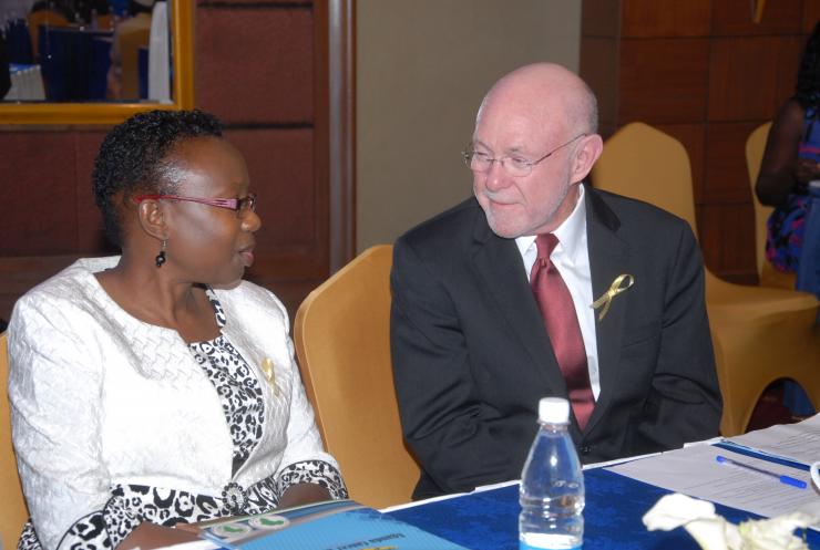Dr. David Poplack speaks with Ugandan Minister of Health Dr. Jane R. Aceng.
