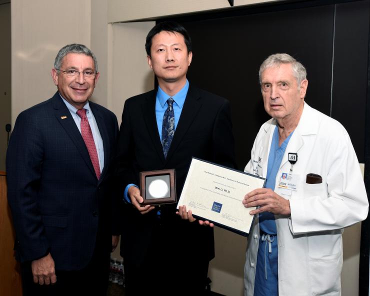 From left to right: Dr. Paul Klotman, Dr. Wei Li and Dr. George Noon