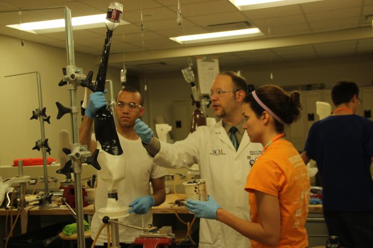 Students and faculty working in the fabrication lab.