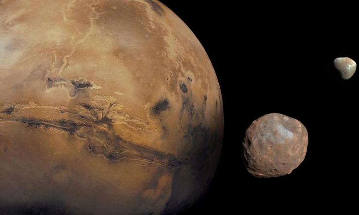 A picture of the planet Mars with two of its moons - Phobos and Deimos. 