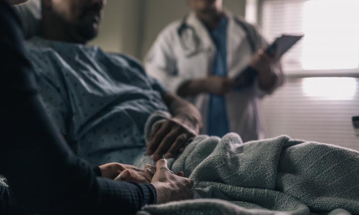 Man in hospital bed