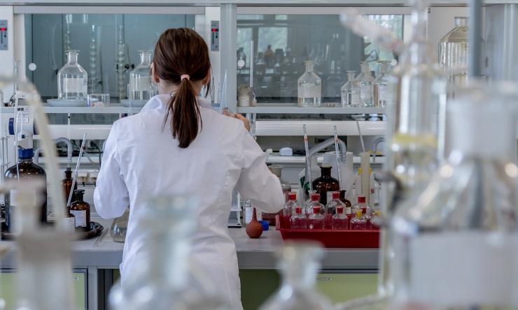 Woman in lab coat in research lab