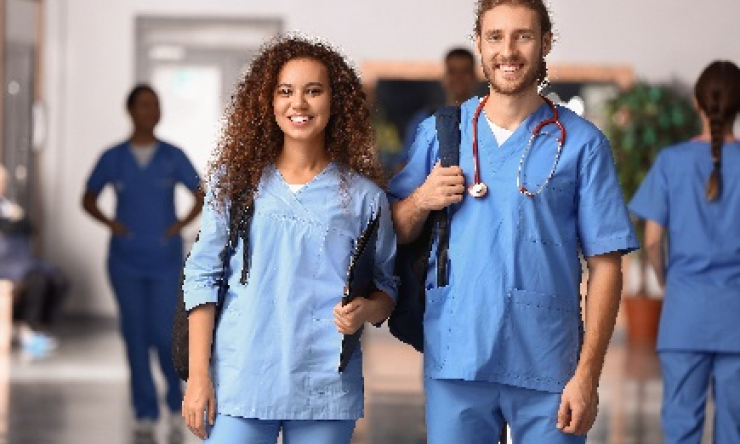 Two students in medical scrubs