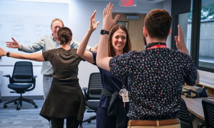 Faculty participating in team building exercise