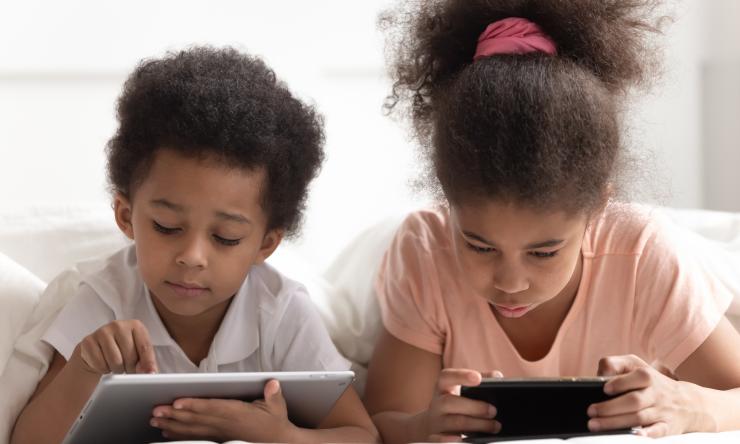 Kids using smartphone and tablet