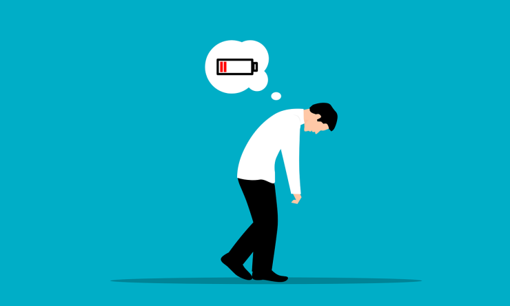 Drawing of a man slumped over and walking with a thought bubble of a uncharged battery to represent being burned out. 