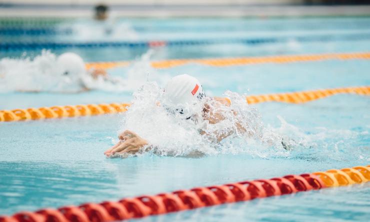 Photo of a person swimming in a race
