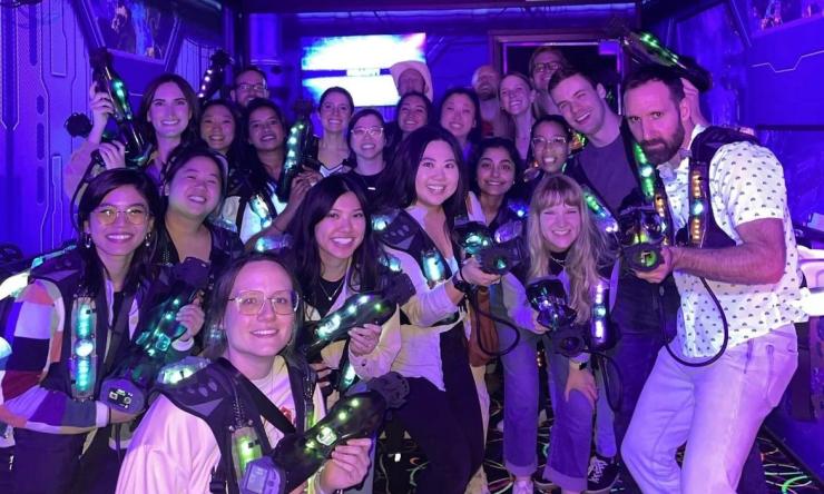 group of people smiling at laser tag place