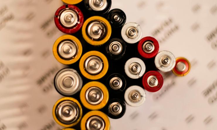 Photo of batteries staying on end in the shape of a triangle