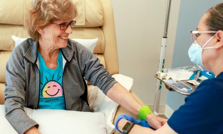 Photo of an older woman having blood drawn