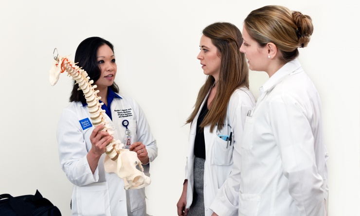 Dr. Rosalyn Nguyen instructing medical student Katherine Calaway and Resident Dr. Erika Moody.