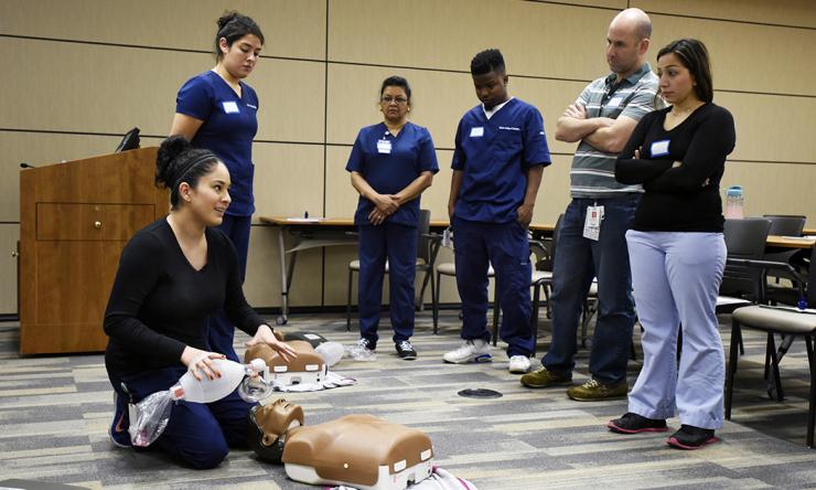 A Baylor College of Medicine community nurse providing CPR training.