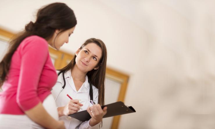 Doctor screening pregnant woman
