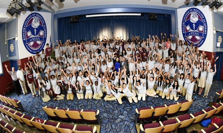 The inaugural graduating class of 8th graders at the Baylor College of Medicine Academy at Ryan pose for a photo with Baylor's President, CEO and Executive Dean Dr. Paul Klotman.