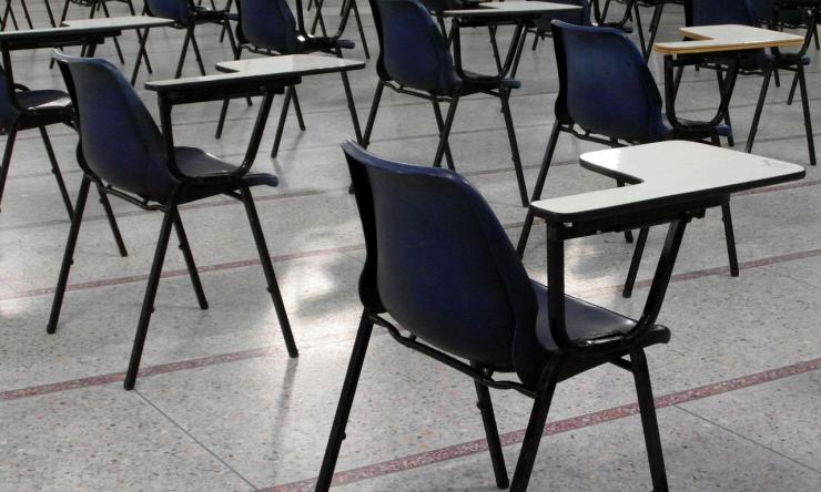 An empty classroom. Dr. Laurel Williams discusses the psychological effects of active shooter drills and metal detectors on schoolchildren.