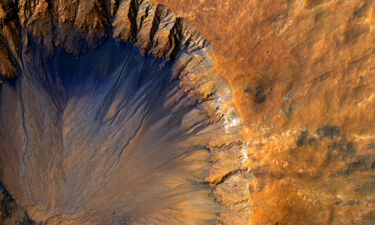 Impact crater in the Sirenum Fossae region of Mars on March 30, 2015.